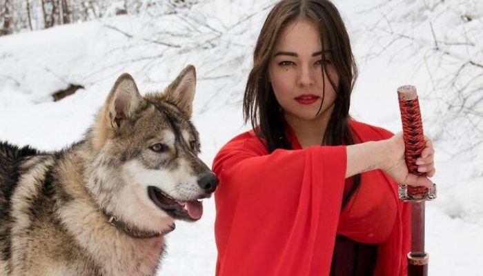 When a mother wolf pup was discarded, a kind young woman took her in and nurtured her as her own