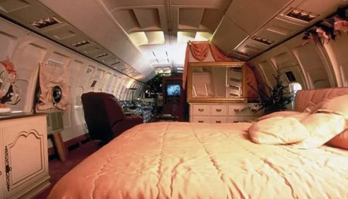 The woman has bought a decommissioned plane, has put it in the forest and has moved there to live.