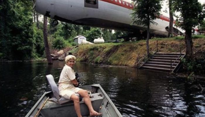 The woman has bought a decommissioned plane, has put it in the forest and has moved there to live.