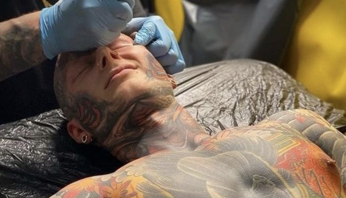 Unnaturally appealing. An American who had tattoos all over him showed how he showed up without them.