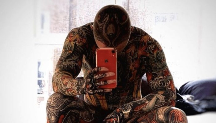 Unnaturally appealing. An American who had tattoos all over him showed how he showed up without them.