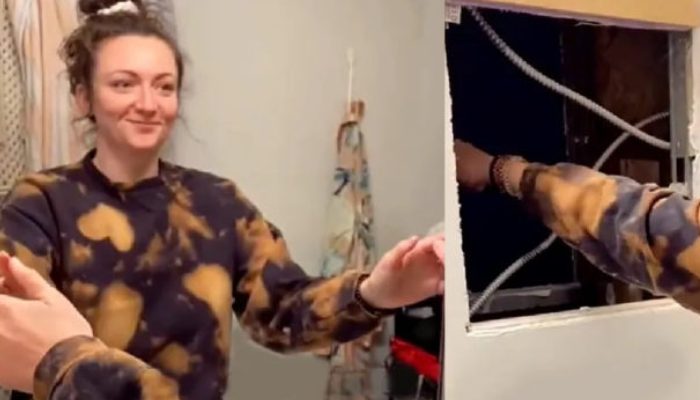 The lady found an empty room behind the mirror in her bathroom and decided to check it out.