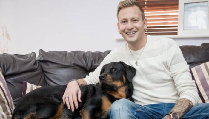 As the man lay unconscious, the Rottweiler unlocked the door for the paramedics, saving his life.