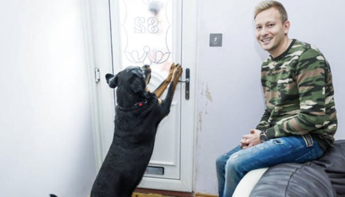 As the man lay unconscious, the Rottweiler unlocked the door for the paramedics, saving his life.