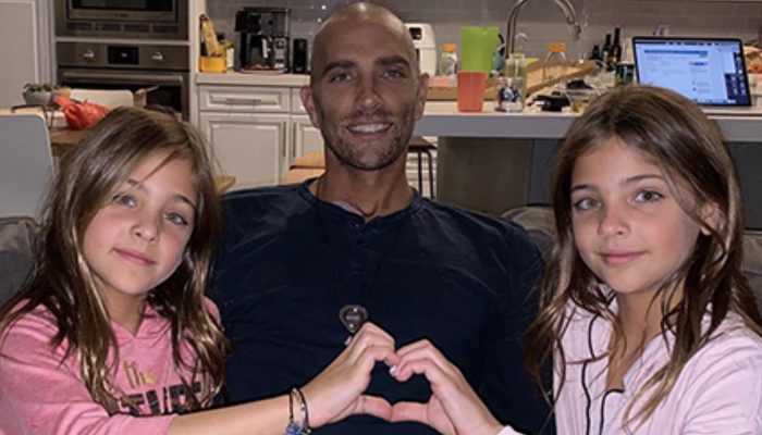 The girls are as beautiful as their dad. A photo of the dad of the most beautiful twins in the world.