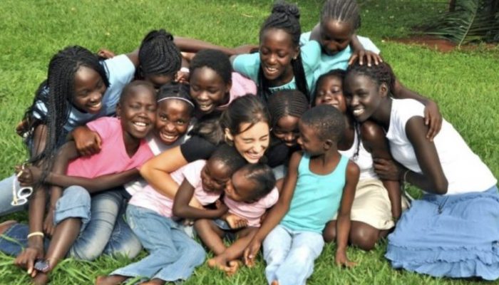 A young woman adopts and takes home a brood of thirteen kids to raise as his own before getting married.