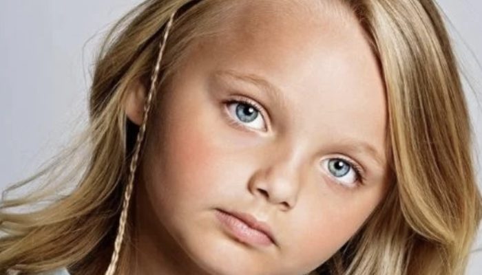 What is the current appearance of the girl who was thought to be a doll when she was younger?