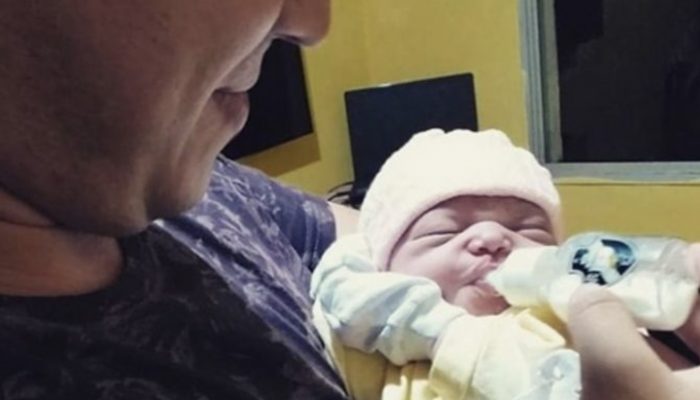 The newborn greeted her father with a big smile and recognized his voice as soon as she entered the world.