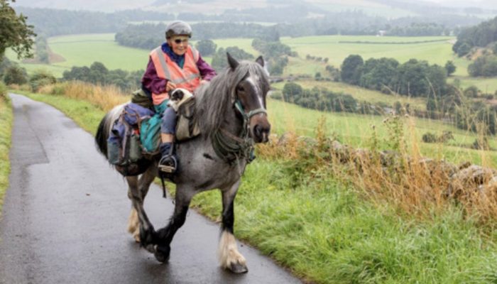 An 80-year-old woman travels approximately 1,000 kilometers on horseback each year with her disabled dog.