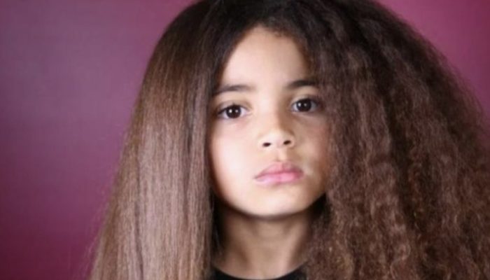 The boy's beautiful hair helped him become a famous when his parents stopped cutting it.