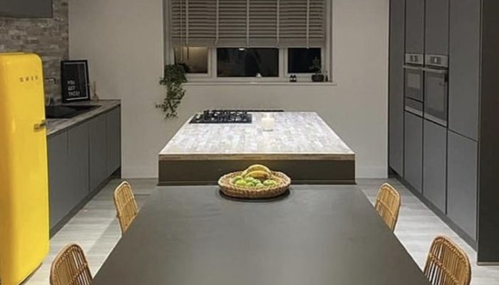 A family transformed a junk-filled house into a super-apartment over the period of two years of work.