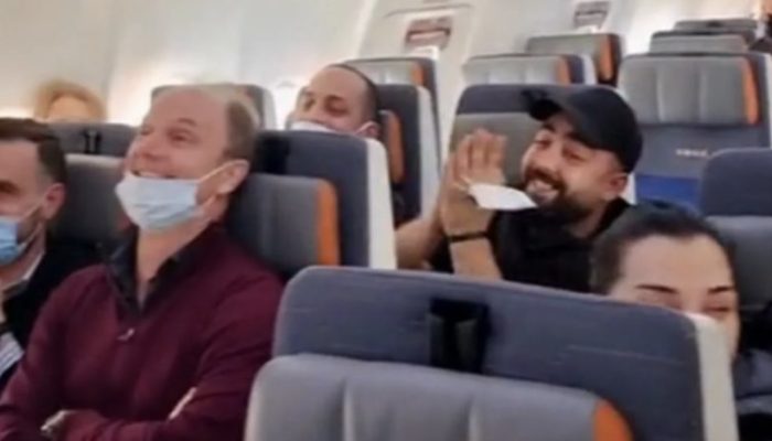 On the flight, the baby was crying continuously, but as the passengers began to sing and that made her smile.