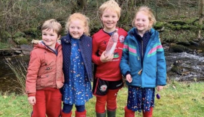 Mother and children discovered a bottle containing a message from a former student hidden inside.