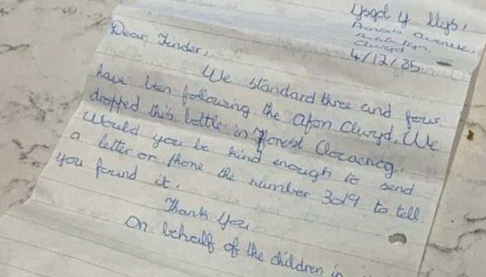 Mother and children discovered a bottle containing a message from a former student hidden inside.