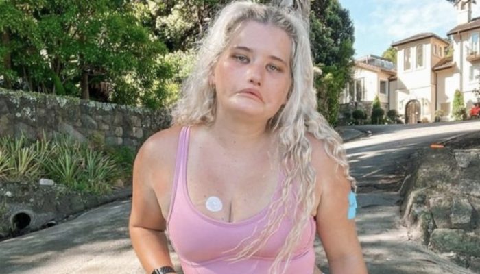 A girl with a habit for never smiling signed her first job with a modeling agency.