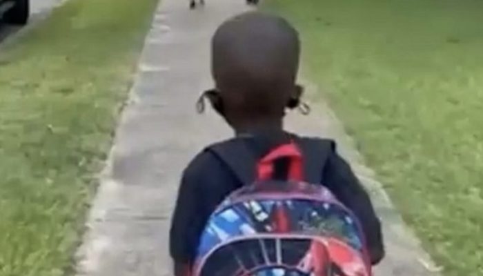 On the first day of school, a lovely first-grader dances joyfully.