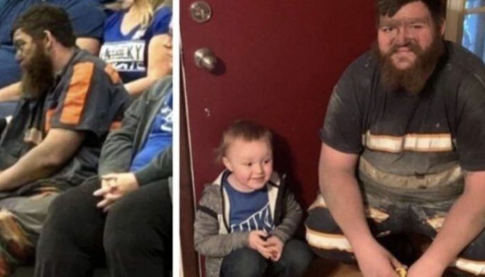 Miner brought his son to the game directly after work. He didn't even have time to change his clothes.