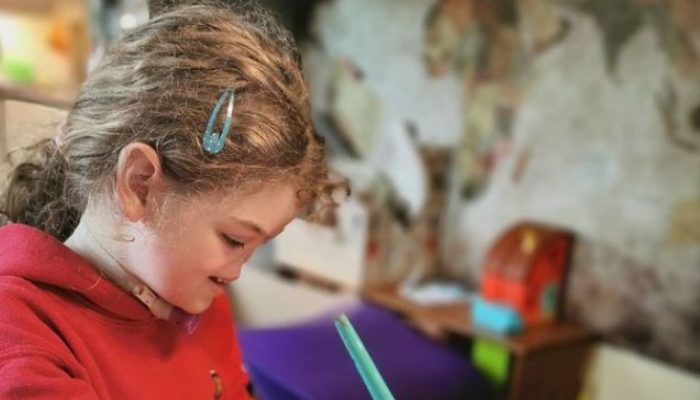 Tell us about the child's life now that she is eight years old and has lived without a nose from birth